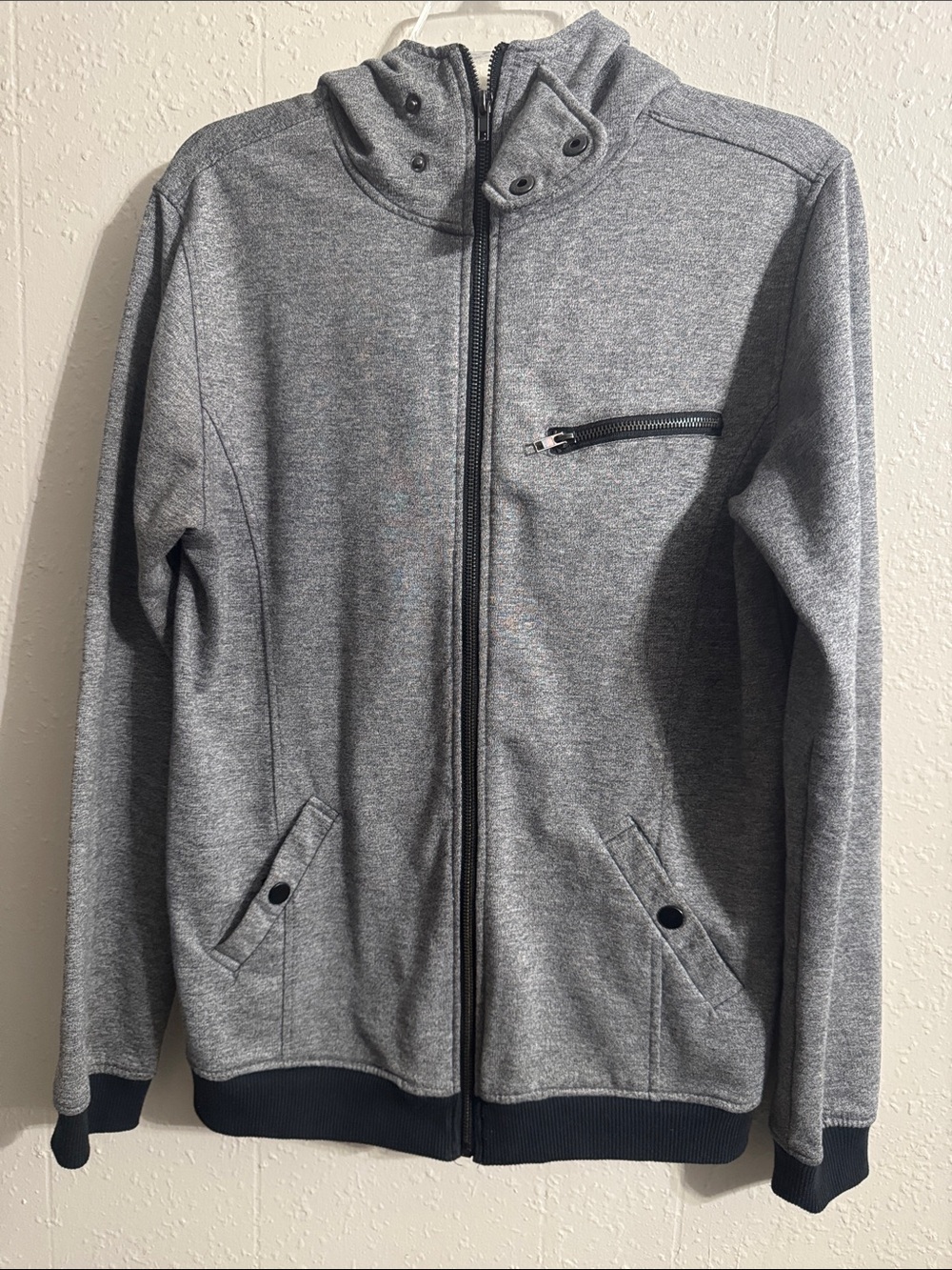 The Narrows gray and black zip-up hoodie jacket with a snap-button funnel neck